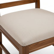 Siramica beige cushioned chair seat close-up