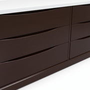 Brown dresser with multiple drawers on a white background