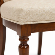Drum dining chair seat edge and turned leg close-up