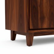 Close-up of a wooden cabinet with a white background