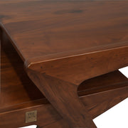 Rocket Coffee Table’s rich brown wood grain of the upper platform meets the supporting side structure with angled joinery is shown.
