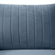 Close-up of a blue quilted headboard on a white background