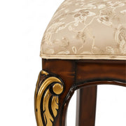 Bisaco damask seat and gold-carved leg close-up