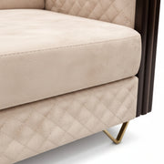 Beige quilted sofa with gold legs on a white background