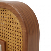 Close-up of a wooden chair with wicker backrest on a white background