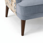 Gray upholstered chair with wooden legs on a white background