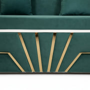 Green sofa with gold geometric design on a white background