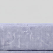 Close-up of a textured gray fabric with a subtle pattern