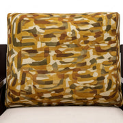 Camouflage-patterned pillow on a chair with a white background