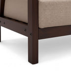 Close-up of a wooden chair leg with a beige cushion on a white background