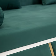 Close-up of a green fabric surface with a white stripe