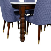 Jazz blue quilted chairs and turned table leg close-up