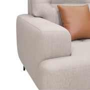 Gray sofa with a brown pillow on a white background
