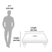 Measurement chart showing a table's dimensions relative to a human figure.
