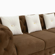 Brown sofa with white cushions