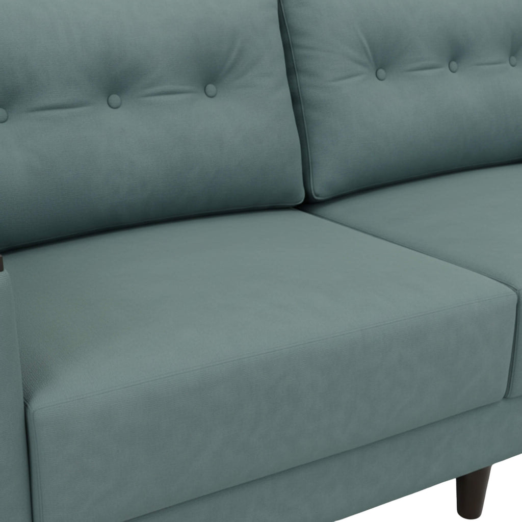 Pacific 3 Seater Sofa’s smooth upholstery and a sleek structured finish depict a clean and contemporary aesthetic.