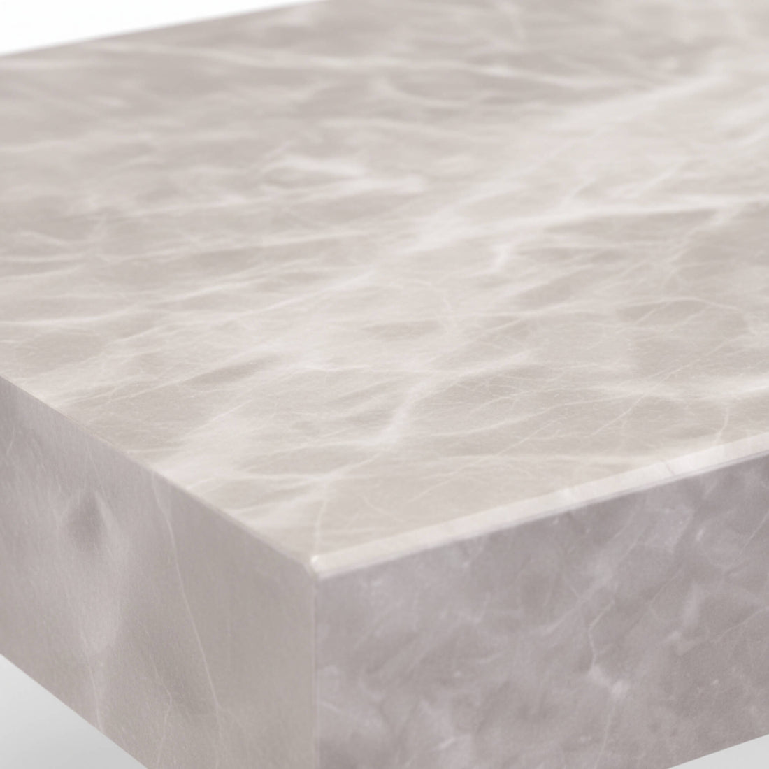 Aspire Coffee Table’s thick block profile and detailed textures of its grey-beige stone surface make it appealing.