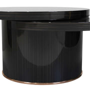 N302A coffee table comes with the reflective black lacquer finish of the cylindrical base and the overlapping upper panels.