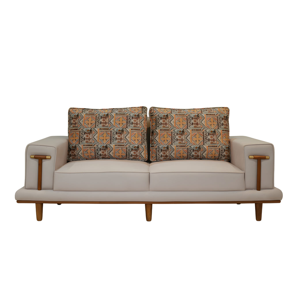 Lavish 3 Seater Sofa is a three-seater sofa featuring soft beige upholstery, slim wooden legs, and patterned back cushions
