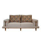 Lavish 3 Seater Sofa is a three-seater sofa featuring soft beige upholstery, slim wooden legs, and patterned back cushions
