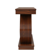 Monarch Console Table’s sleek pedestal-style wooden table with a vertically grooved central support and a square tabletop is showcased.
