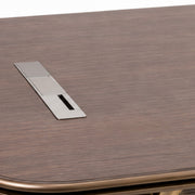 Wooden table with a metallic panel on a white background